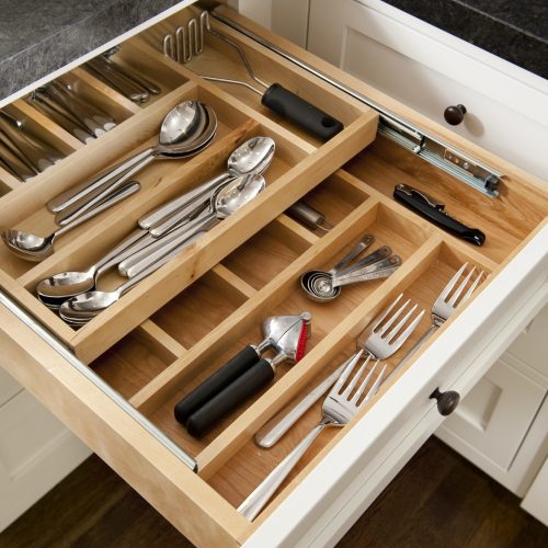 Kitchen silverware drawer with compartments.